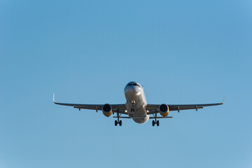 Passenger airplane on approach to the airport landing - stock photo