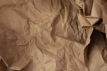 Blank Creased reusable and recyclable wrap natural light brown or beige tone color with blank kraft paper texture background to be use for website page or environmental friendly packaging