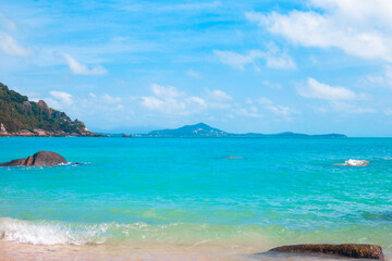 Sea bright landscape. Azure sea and stones in the water on a sunny day. Wallpaper, postcard, travel concept