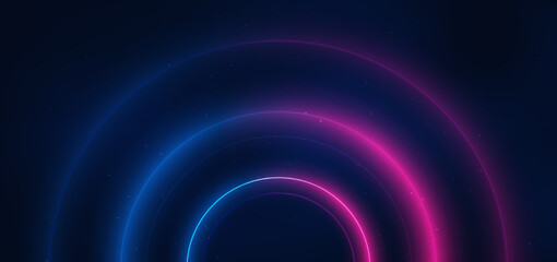 Abstract technology futuristic neon circle glowing blue and pink  light lines with speed motion blur effect on dark blue background.