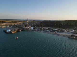 Obraz premium Aerial view of Zrce Beach Festival in Novalja, island Pag, archipelago of Croatia. People partying on a hot summer day on Zrce beach. Zrce beach is the most popular party destination on Adriatic sea.
