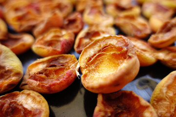 drying apricots in the sun, fruit drying, dried apricots, natural apricot drying,