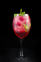 Pink Lady cocktail on black background with frappe
