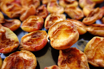 close-up apricot drying process, fruit drying process in summer, drying fruit in the sun,