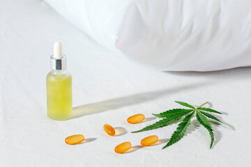 Melotonin production, pills, capsules and cbd oil on the bed. Concept sleep disorder. beat insomnia and restore sleeping routine.