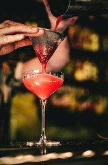 man hand bartender making sweet and sour refreshing cocktail on the bar counter