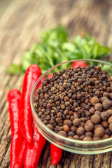 Red chili peppers on the table. Composition of red chili peppers and other spices. The concept of spices, seasonings, traditional cuisine.