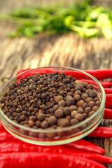 Red chili peppers on the table. Composition of red chili peppers and other spices. The concept of spices, seasonings, traditional cuisine.