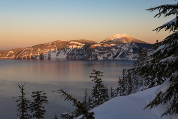 Beautiful sunset view in the Crater Lake in winter. Location is the Crater Lake National Park, Oregon