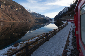 Fototapeta na wymiar Red Express in the Winter Season, Swiss Alps Grindelwald, Switzerland
