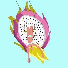 Tiny girl upside down on a swing against the background of a huge dragon fruit, pitaya, pitahiya, summer mood, summer vibes, organic, healthy food, vitamins.