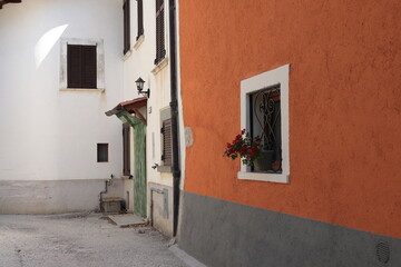 Fototapeta na wymiar Rural Village Street View with House Facades Close Up in Central Italy