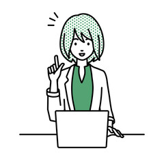 デスクで座ってPCを開いて何かひらめいたジャケットの女性