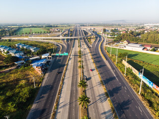 Fototapeta premium Aerial view city asphalt transport junction road morning sun light