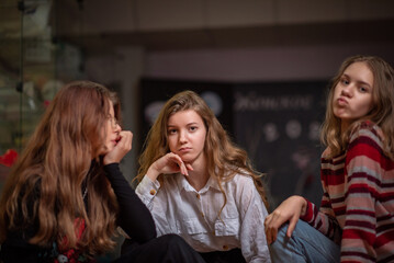 Friends celebrate a holiday in a cafe. There is artistic noise.