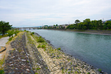 Fototapeta na wymiar Uji river and To no Shima, Tachibanajima Island in Uji, Kyoto, Japan