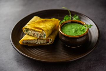 Paneer stuffed Besan chilla or Cheela made using chickpea flour with cottage cheese stuffing
