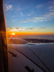Sunset from the porthole of plane with the sea in the background, Algiers, Algeria