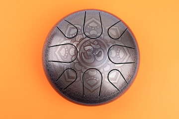 glucophone instrument  for playing music.  Sanskrit OM