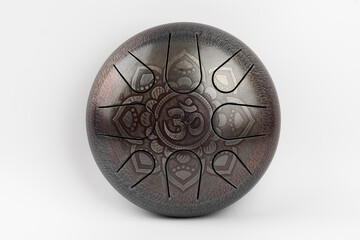 glucophone instrument  for playing music. The inscription in Sanskrit OM