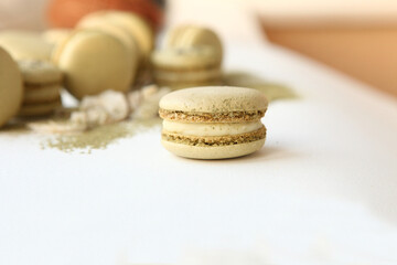 Dessert with coconut. Coconut white chocolate macaroons on a white background. Matcha tea macaroons Sweet present, cafe menu. Sweets still life.