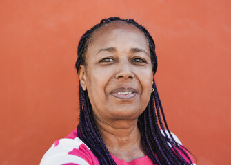 Happy senior african woman taking a selfie outdoor