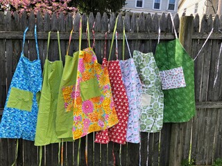 Aprons on a Fence