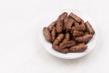 Grilled Kebabs served on the plate with copy space above white background