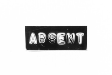 Black color banner that have embossed letter with word absent on white paper background