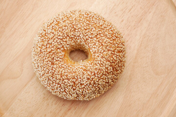 fresh bagel bread in a paper on table 