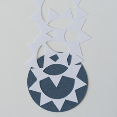 paper gear shapes on blue circle
