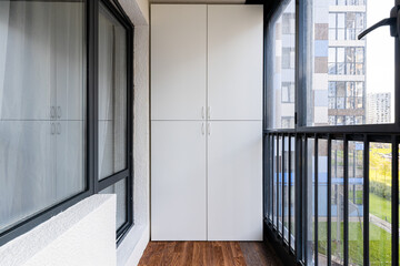 Empty balcony with closet and courtyard view