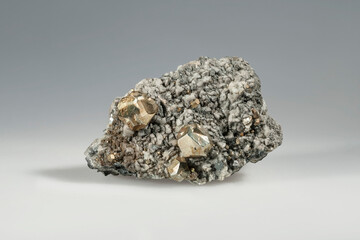 A sample of a natural mineral iron Pyrite (sulfide class) crystals on the calcite brush, fool's gold. Museum Mineral Series. Mineralogical sample