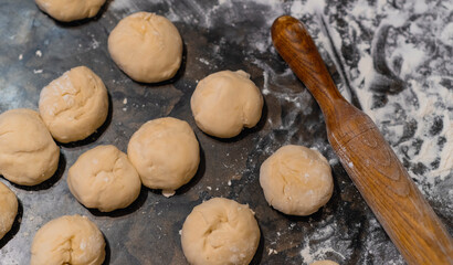Kneading dough and rolling pin. Close up.