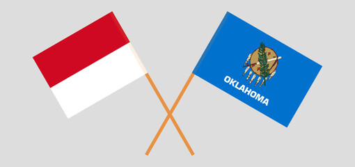 Crossed flags of Monaco and The State of Oklahoma. Official colors. Correct proportion