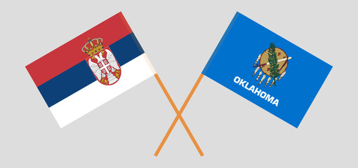 Crossed flags of Serbia and The State of Oklahoma. Official colors. Correct proportion