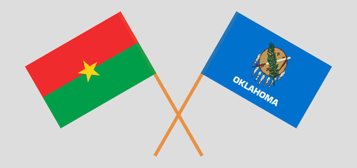 Crossed flags of Burkina Faso and The State of Oklahoma. Official colors. Correct proportion