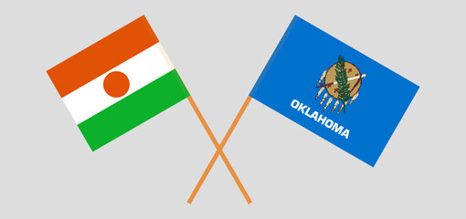 Crossed flags of Niger and The State of Oklahoma. Official colors. Correct proportion