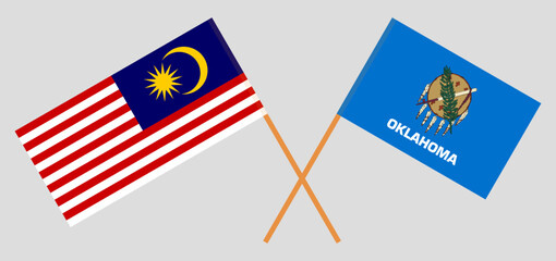 Crossed flags of Malaysia and The State of Oklahoma. Official colors. Correct proportion