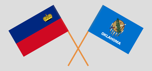 Crossed flags of Liechtenstein and The State of Oklahoma. Official colors. Correct proportion