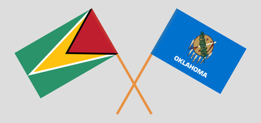 Crossed flags of Guyana and The State of Oklahoma. Official colors. Correct proportion