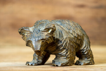 Brown bear, wooden toy, play kit on the wooden table.