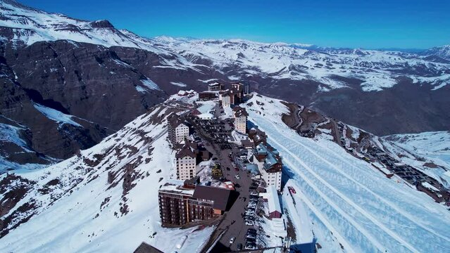 Santiago Chile. Ski station center at snowing Andes Mountains near Santiago Chile. Snow mountain landscape at winterness. Winter ness travel destination. Winter ness tourism travel.