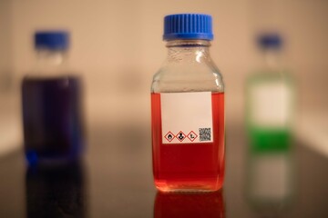 chemical solution glass bottles warning with hazard signs
