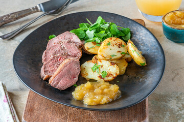 Roasted dack breast with fried potatoes and apple sauce