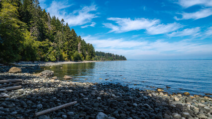 Tranquil Vancouver Island rocky beach seascape of Strait of Georgia near Campbell River, British...