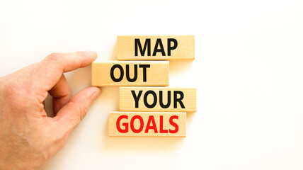 Support and map out your goals symbol. Concept words Map out your goals on wooden blocks on...