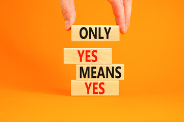 Only yes means yes symbol. Concept words Only yes means yes on wooden blocks on a beautiful orange table orange background. Businessman hand. Business, psychological only yes means yes concept.