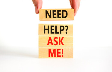 Support and need help ask me symbol. Concept words Need help ask me on wooden blocks on a beautiful white table white background. Businessman hand. Business, support and Need help ask me concept.