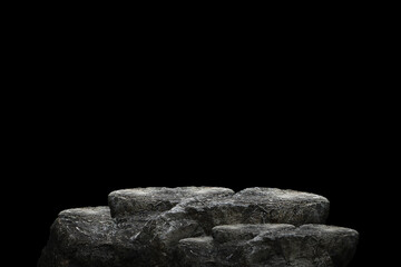 Stone podium on dark black background.